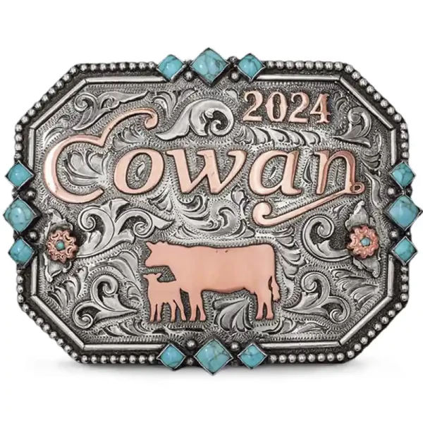 The stunning Tennessee Belt Buckle features a bead edge adorned with turquoise stones, Copper lettering, and flowers, along with intricate hand-engraved scrollwork. Customize this silver and turquoise women's belt buckle with personalized details!